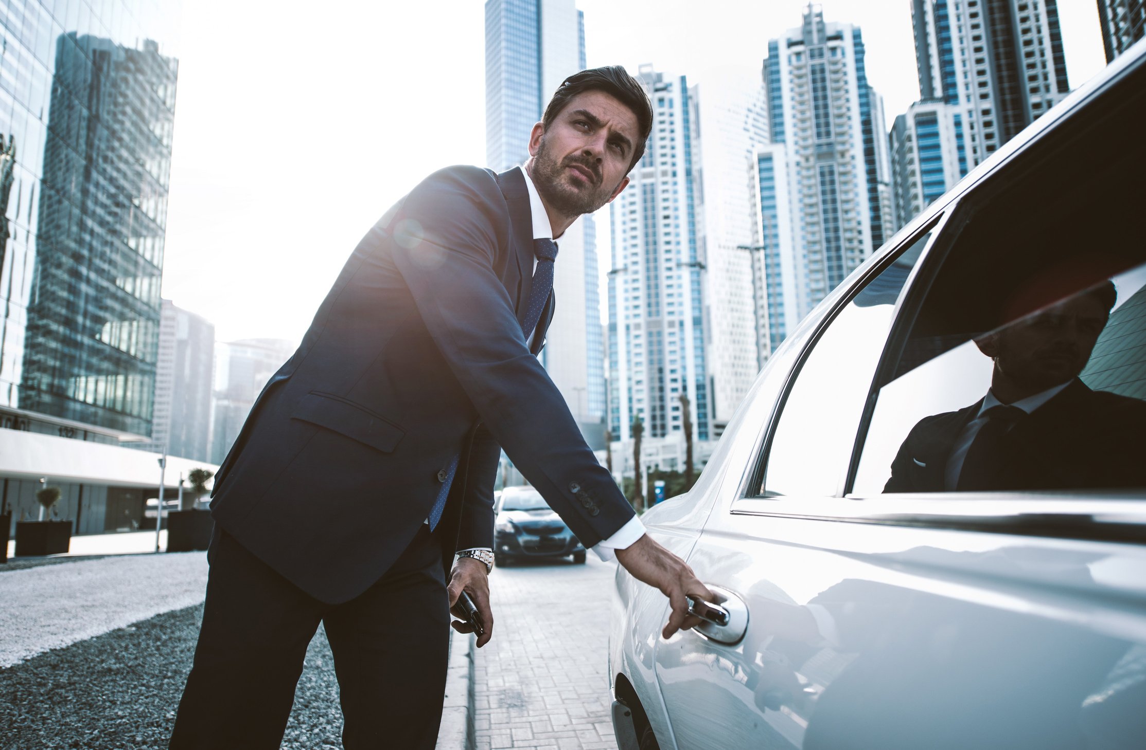 Man Opening Limousine Car Door